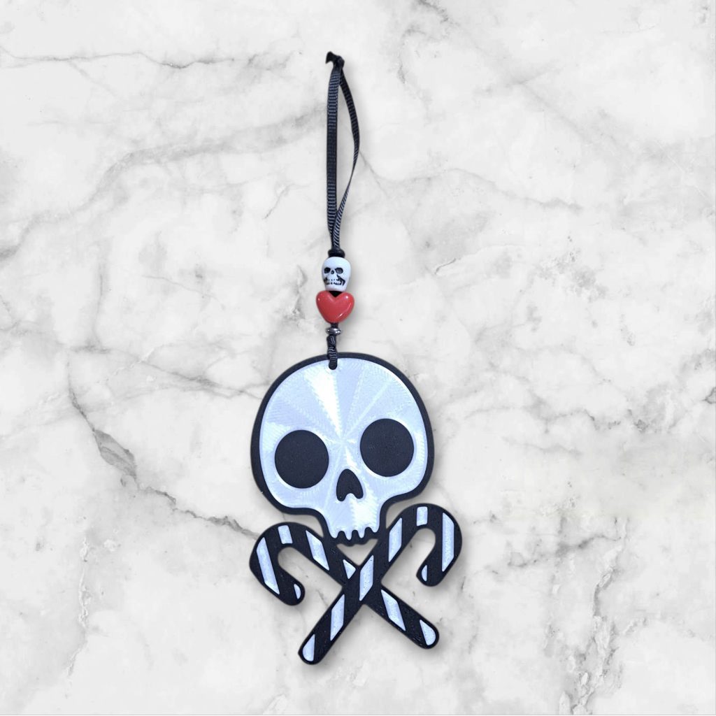 3d printed Skull with crossed candy canes, beaded with a heart and skull ribbon hanger