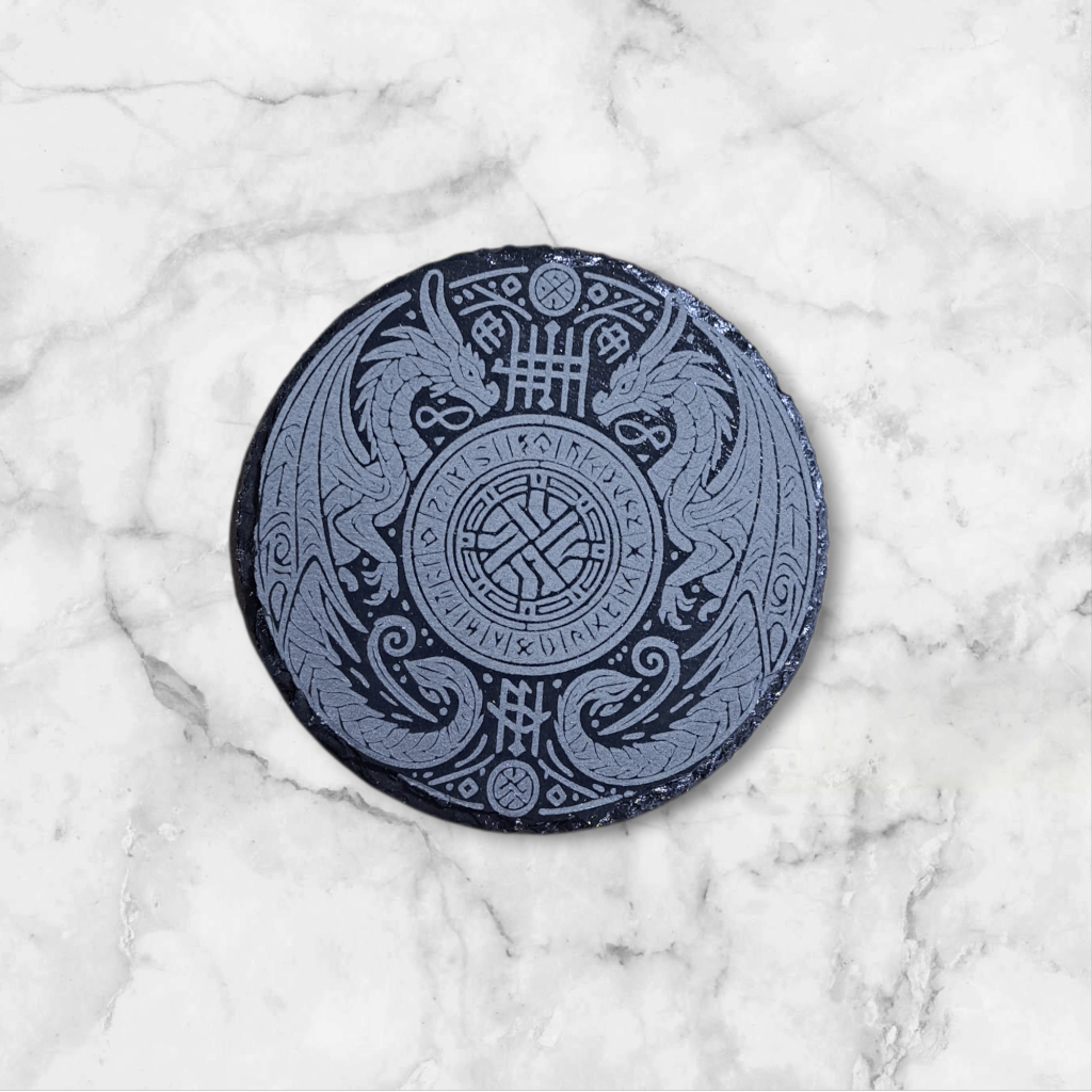 Round slate coaster engraved with a Celtic Double Dragon emblem