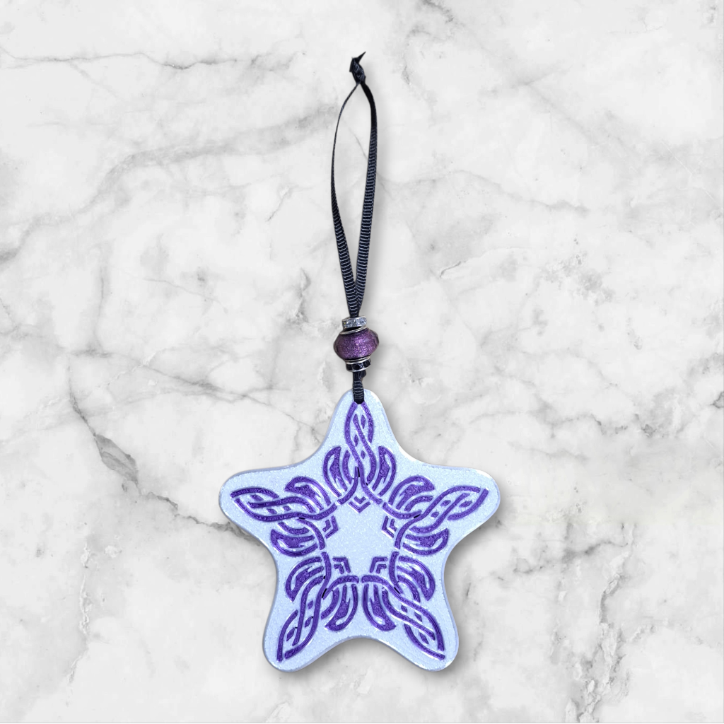 Star-shaped ornament with purple Celtic design and purple sparkle bead on the ribbon