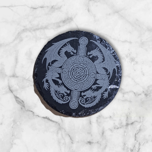 Round slate coaster engraved with Celtic knot design and 2 double dragons