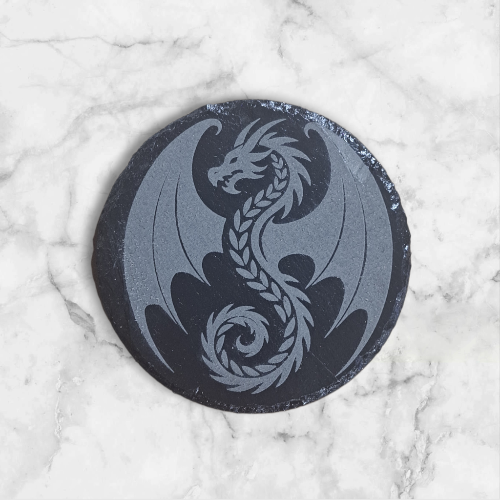 Round slate coaster engraved with a decorative Dragon design