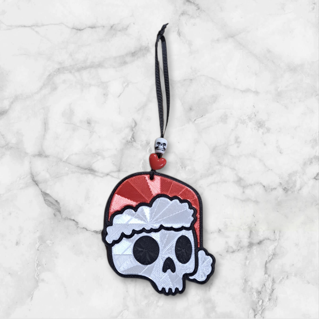 Skull-shaped ornament with a Santa hat 