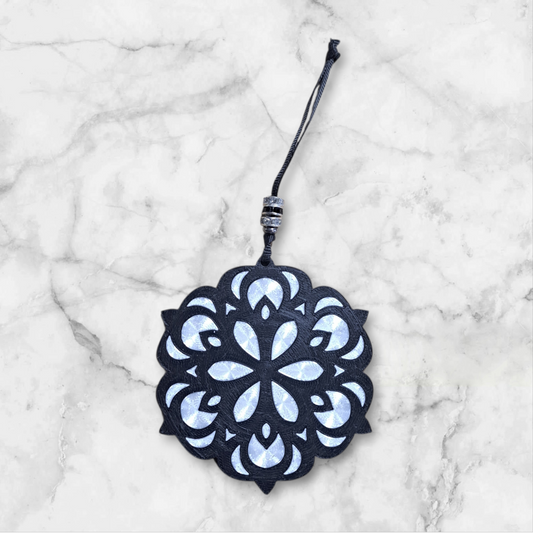 black and white flower design, with black and clear rhinestone beads on the ribbon hanger