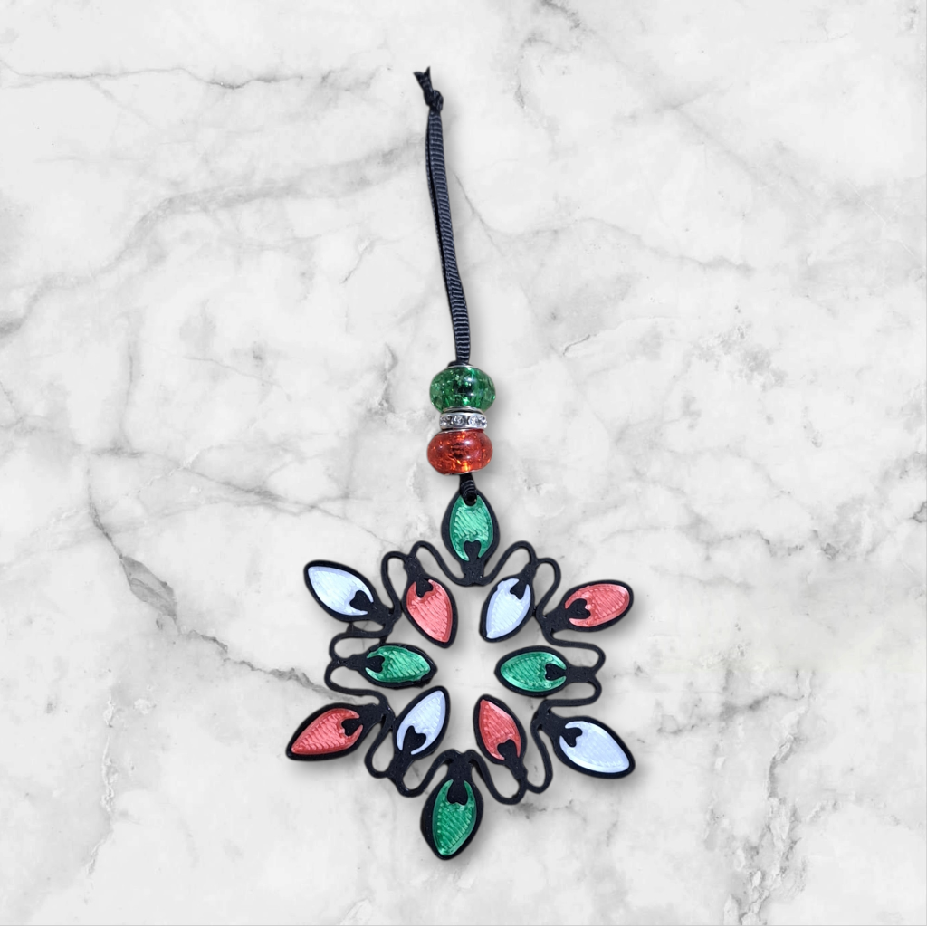 string of Christmas lights ornament, with large red and green beads